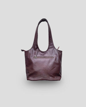 A brown leather handbag with a structured design and a zipper closure at the top.