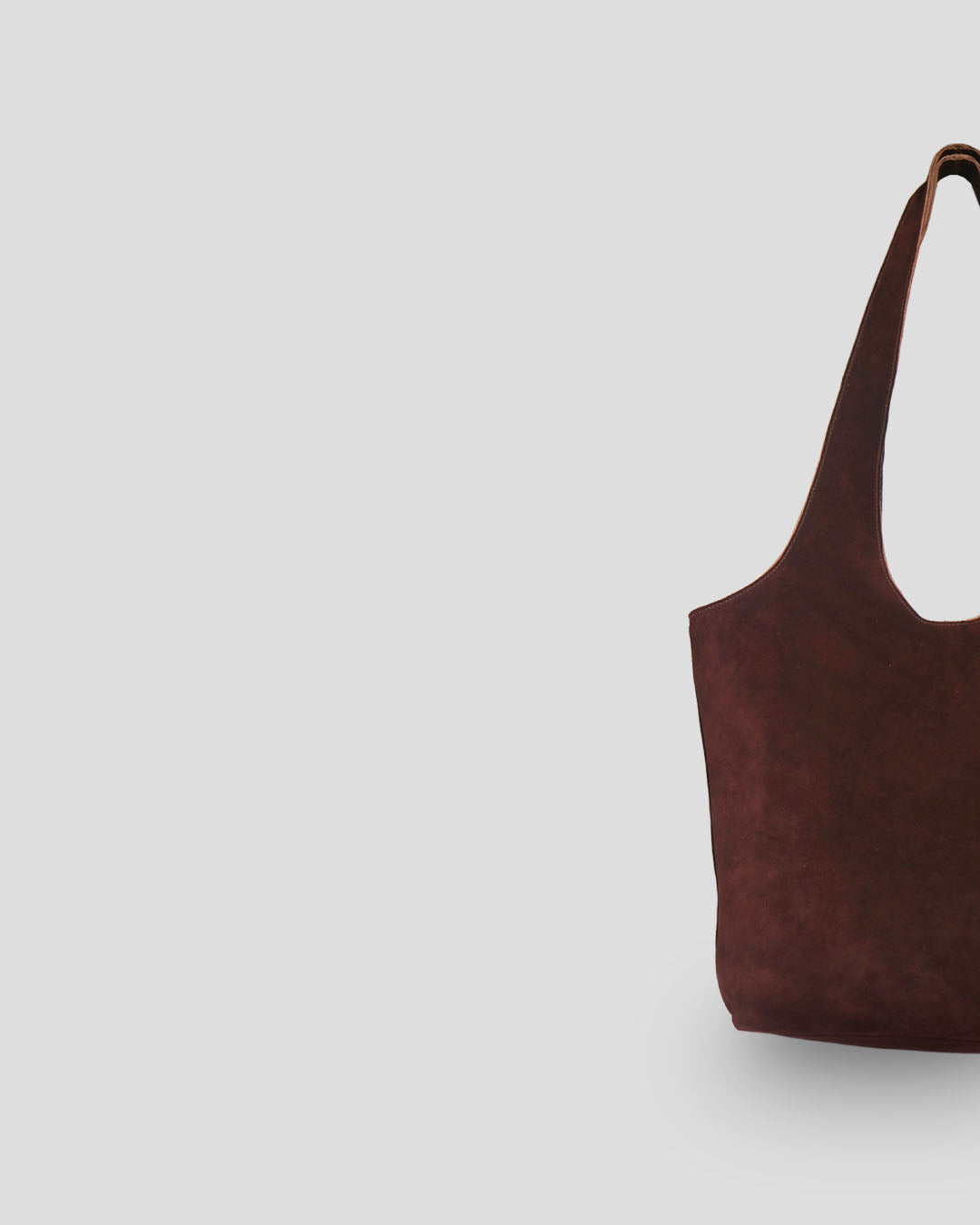 Handmade Bali suede leather bag side view displaying traditional Indonesian suede craftsmanship