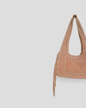 Brown handbag with studded details on a light gray background