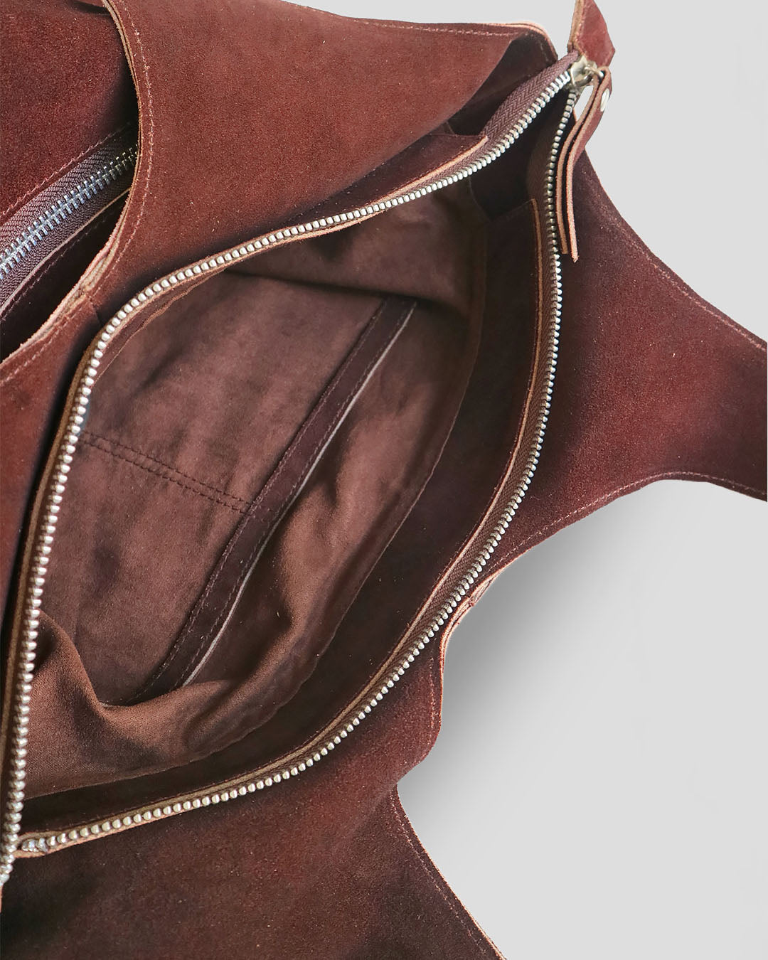 Brown suede leather bag with zipper detail by nam leather