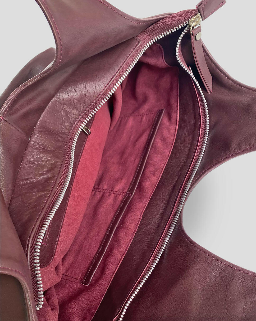 Indonesia leather goat leather bag interior showing zipper closure and multiple pockets