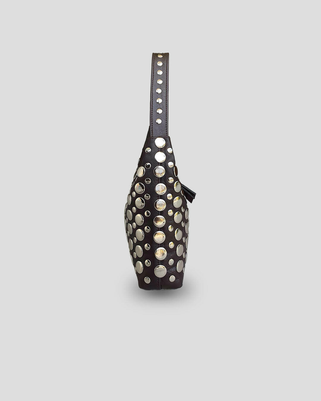 Black bag with silver studs on a light gray background