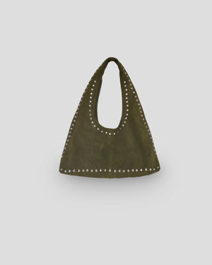 Green handbag with studded details on a light gray background