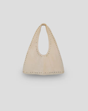 Navya edgy suede shoulder bag in beige with metallic stud accents - premium Indonesian leather