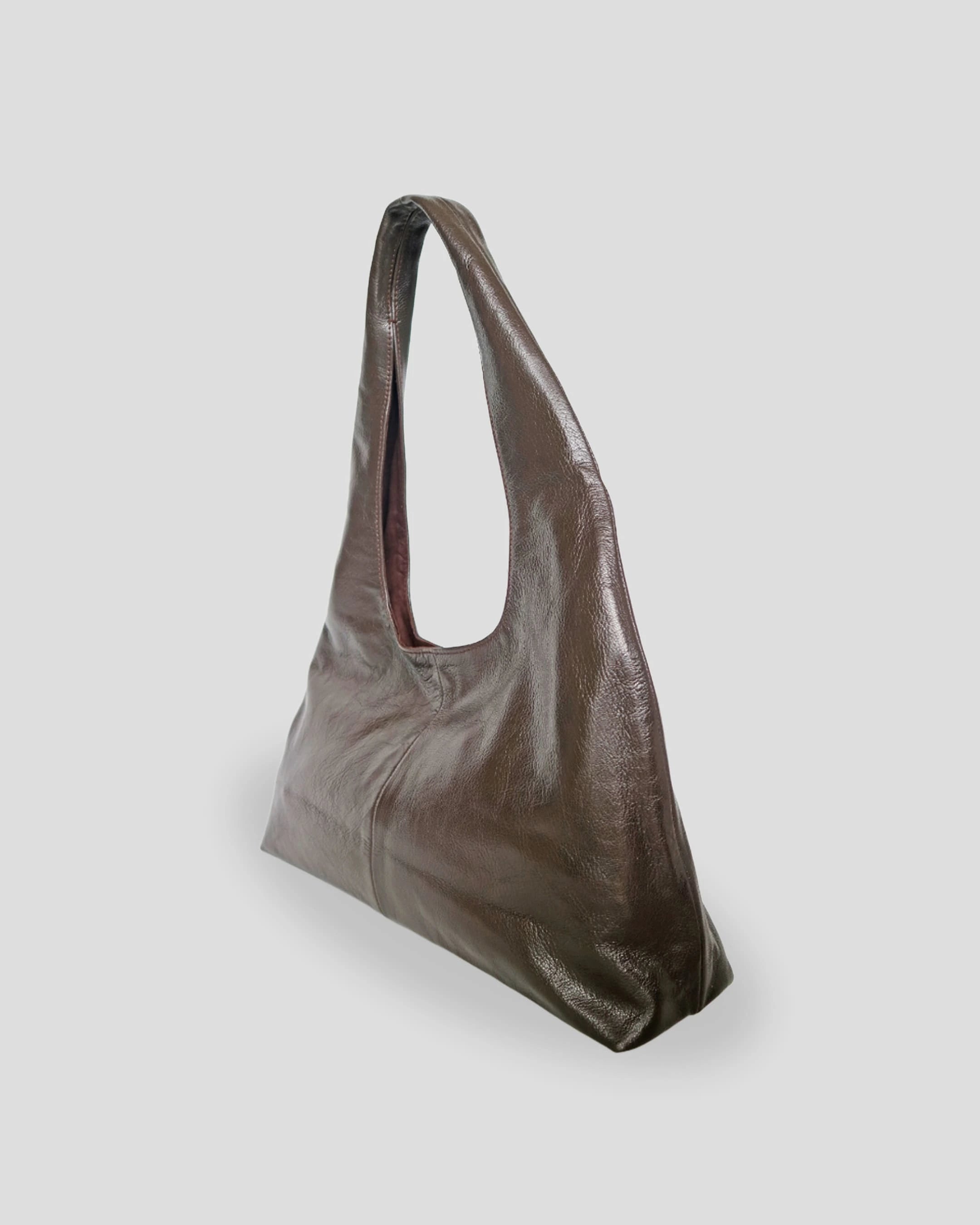Brown leather shoulder bag for women with spacious interior in france