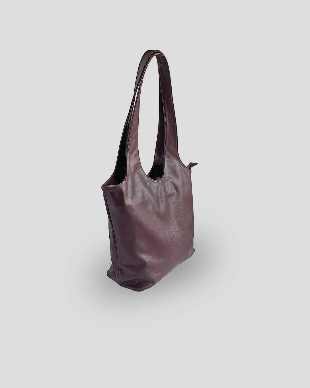 Authentic Balinese leather bag side view showing premium goat leather texture