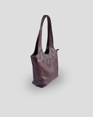 Authentic Balinese leather bag side view showing premium goat leather texture